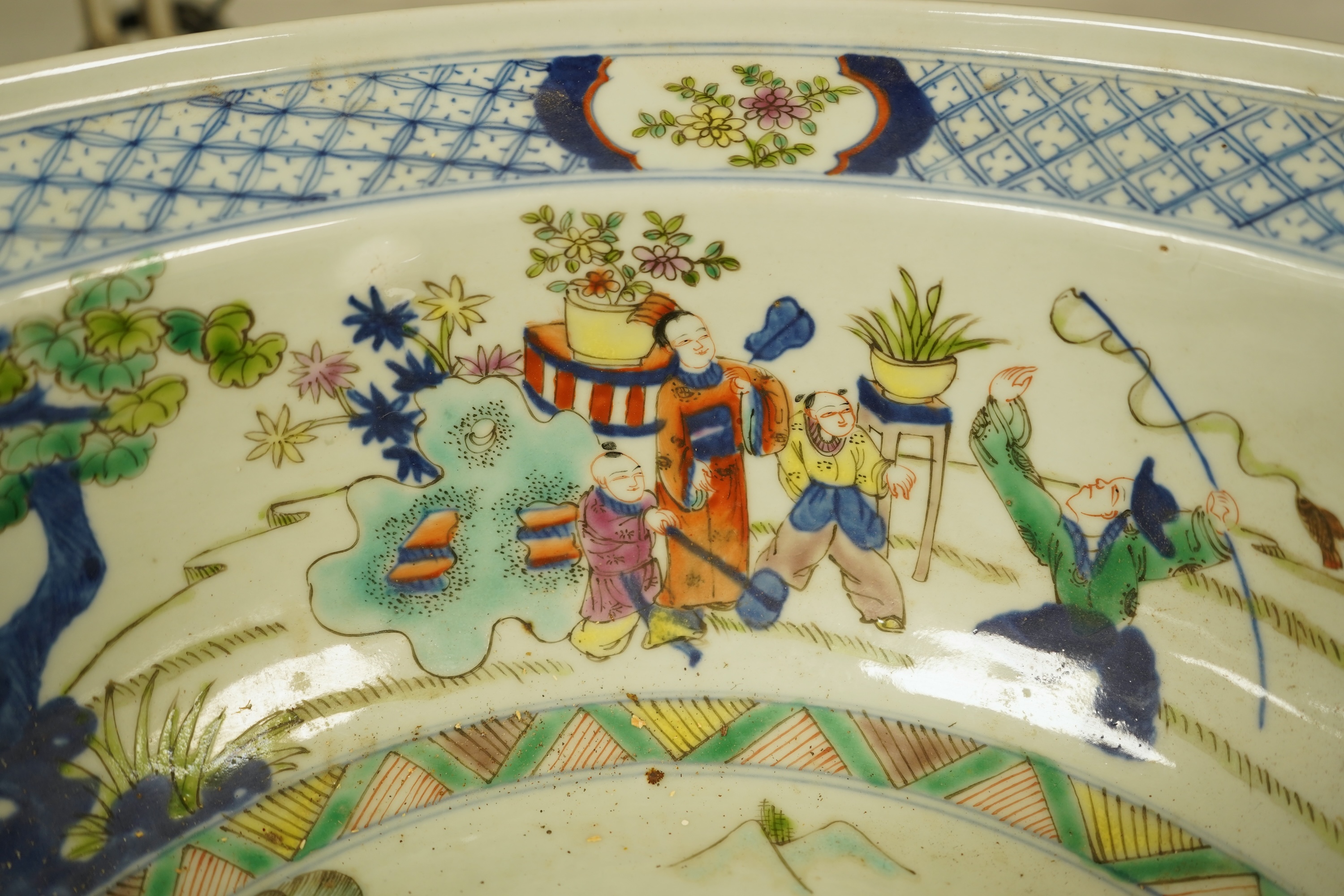 A large Chinese porcelain basin enamelled with figures, 41cm in diameter